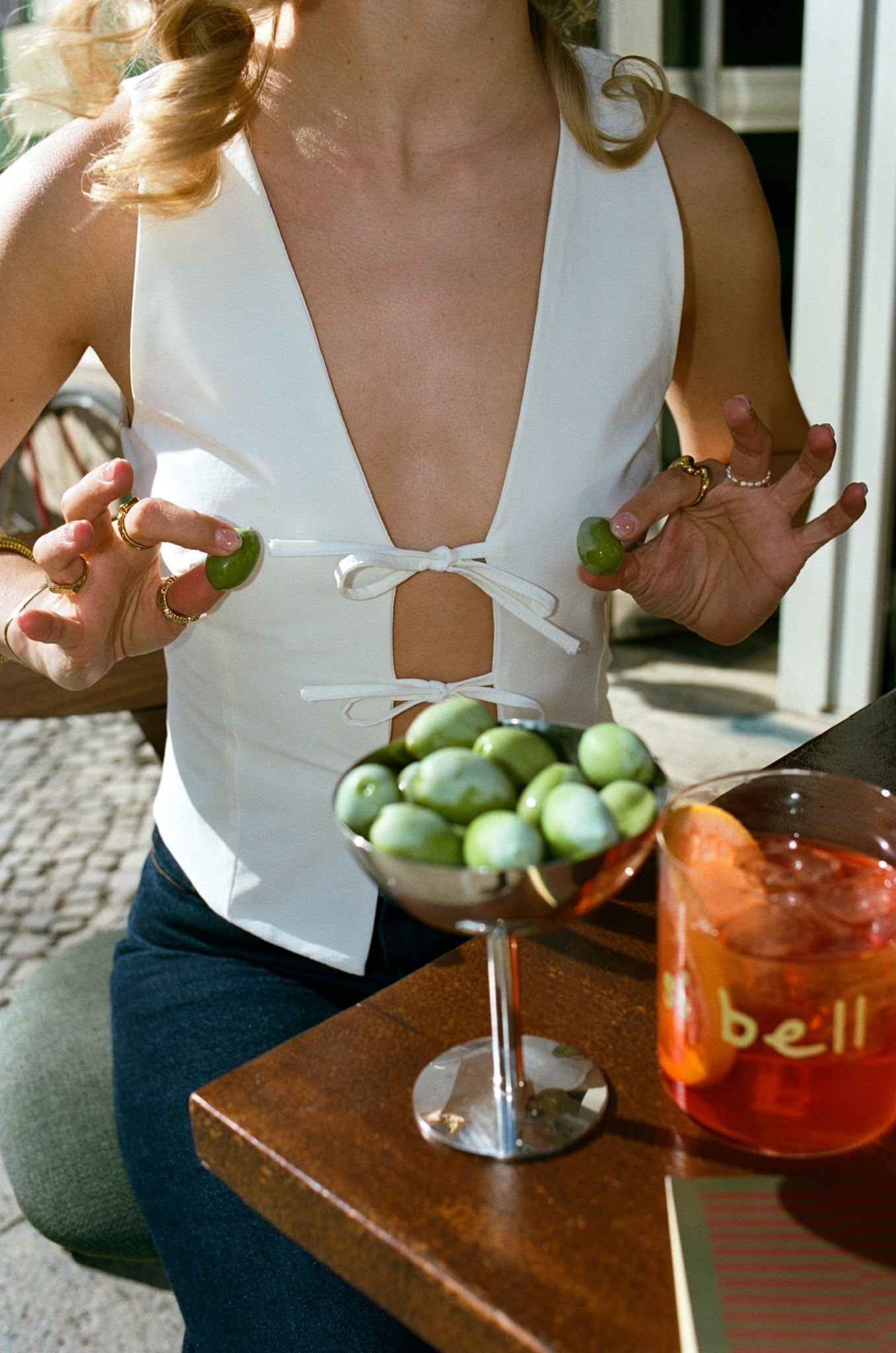 Olives and an Aperol spritz in the afternoon sun
